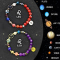Two natural stone beaded bracelets displaying zodiac symbol charms on a neutral background.
