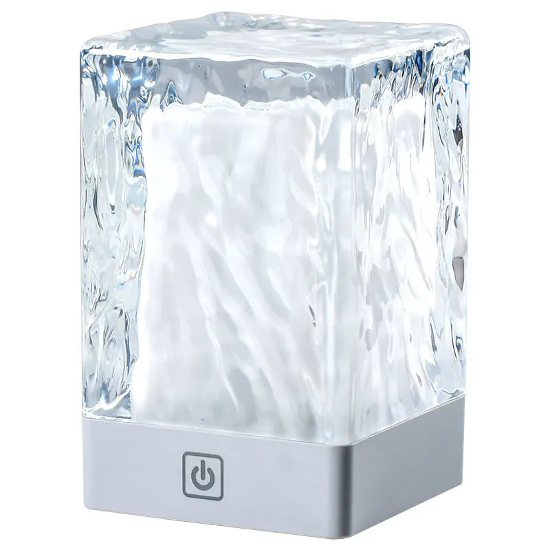 Compact crystal lamp 80x80x12mm with touch sensor and USB cable on a wooden desk