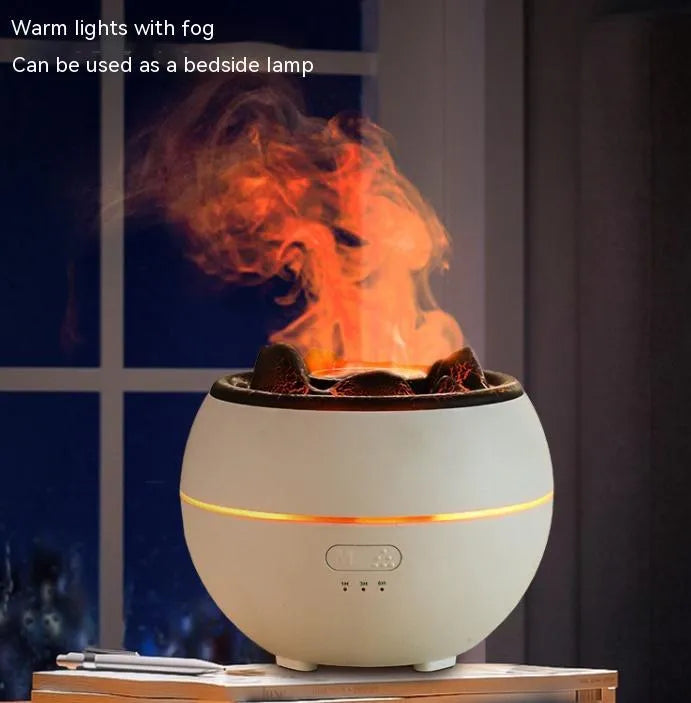 White round flame aroma diffuser humidifier with timer settings on a desk.
