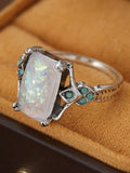 Rectangular white opal ancient silver ring on finger, silver tone, geometric design, alloy