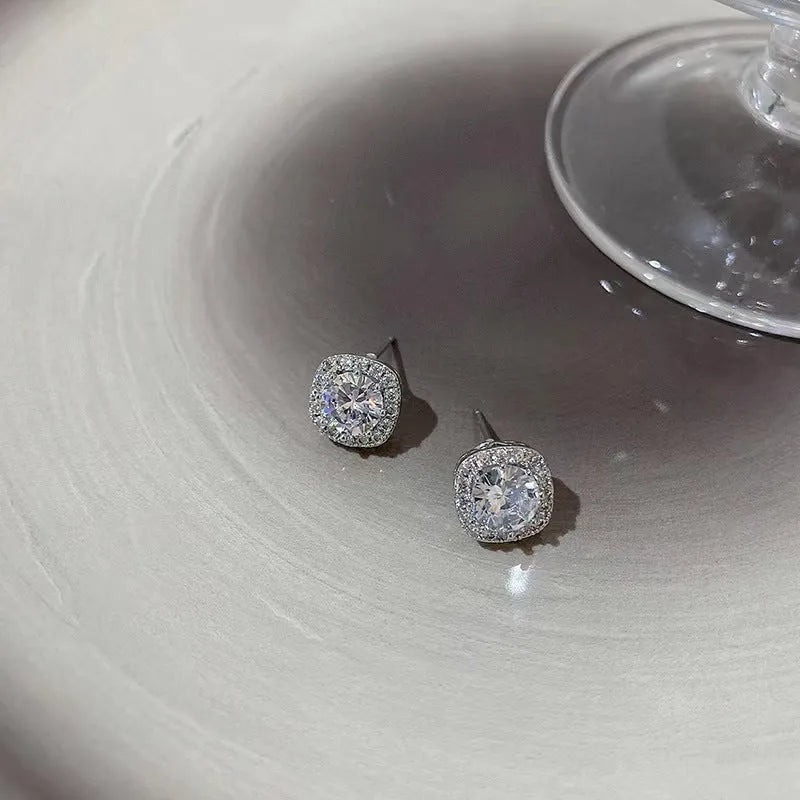 A pair of square geometric women's earrings with a diamond-treated surface in a gold colour option.