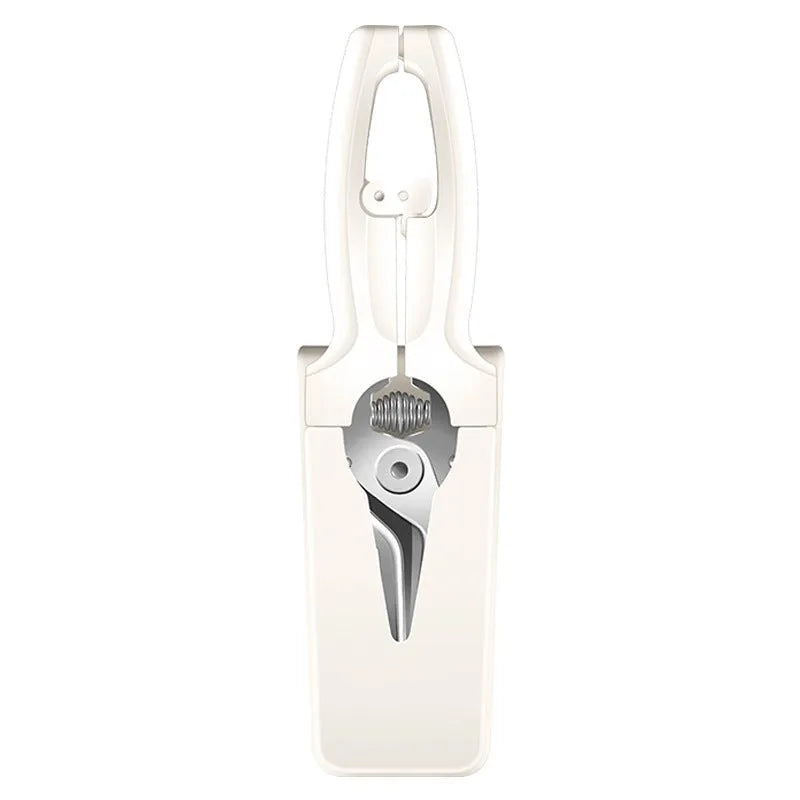 Creative magnetic suction kitchen scissors in stainless steel on a fridge door