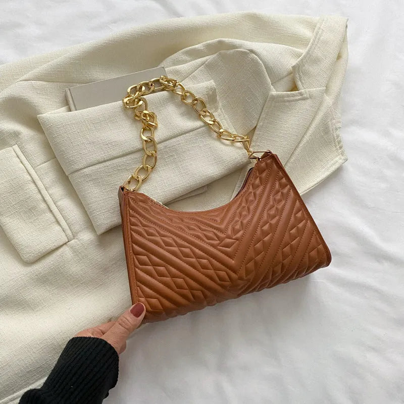 Brown PU pleated chain baguette shoulder bag showing vertical square shape and soft carry handle.