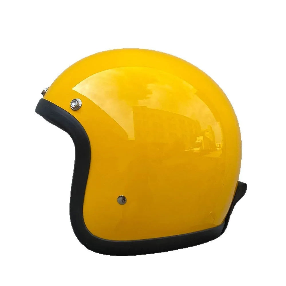 A retro-style grey half helmet for motorcycle riding, shown on a stand.