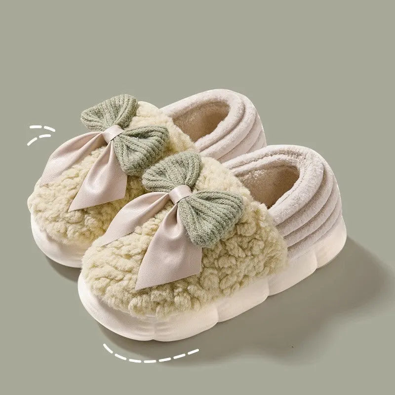 Big bow-knot fluffy slippers with covered heel in pink colour on floor