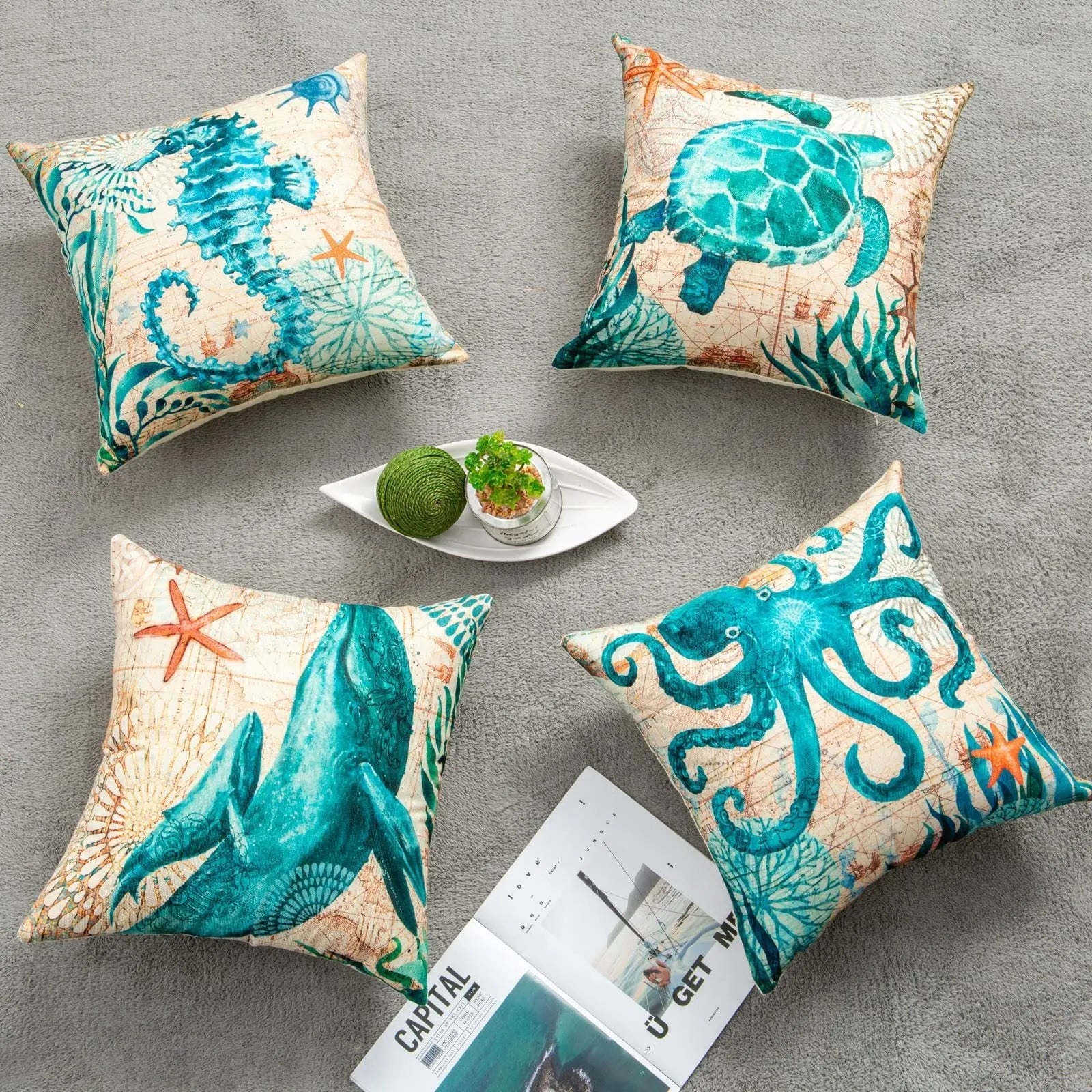 Square linen cushion cover with a detailed blue and green sea turtle print, showing the invisible zipper closure.