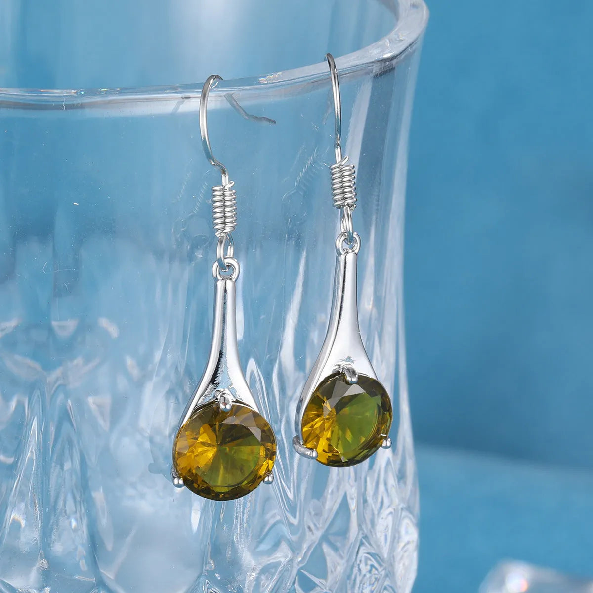Olive green drop shape alloy earrings with electroplated finish and retro minimalist styling