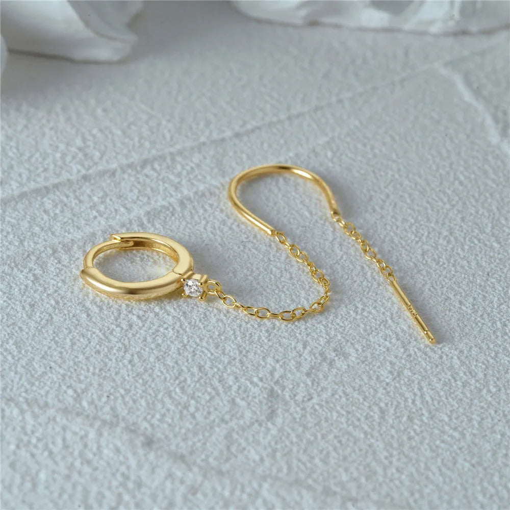 Golden S925 sterling silver stud earrings with a geometric diamond flower and delicate tassel chain design.