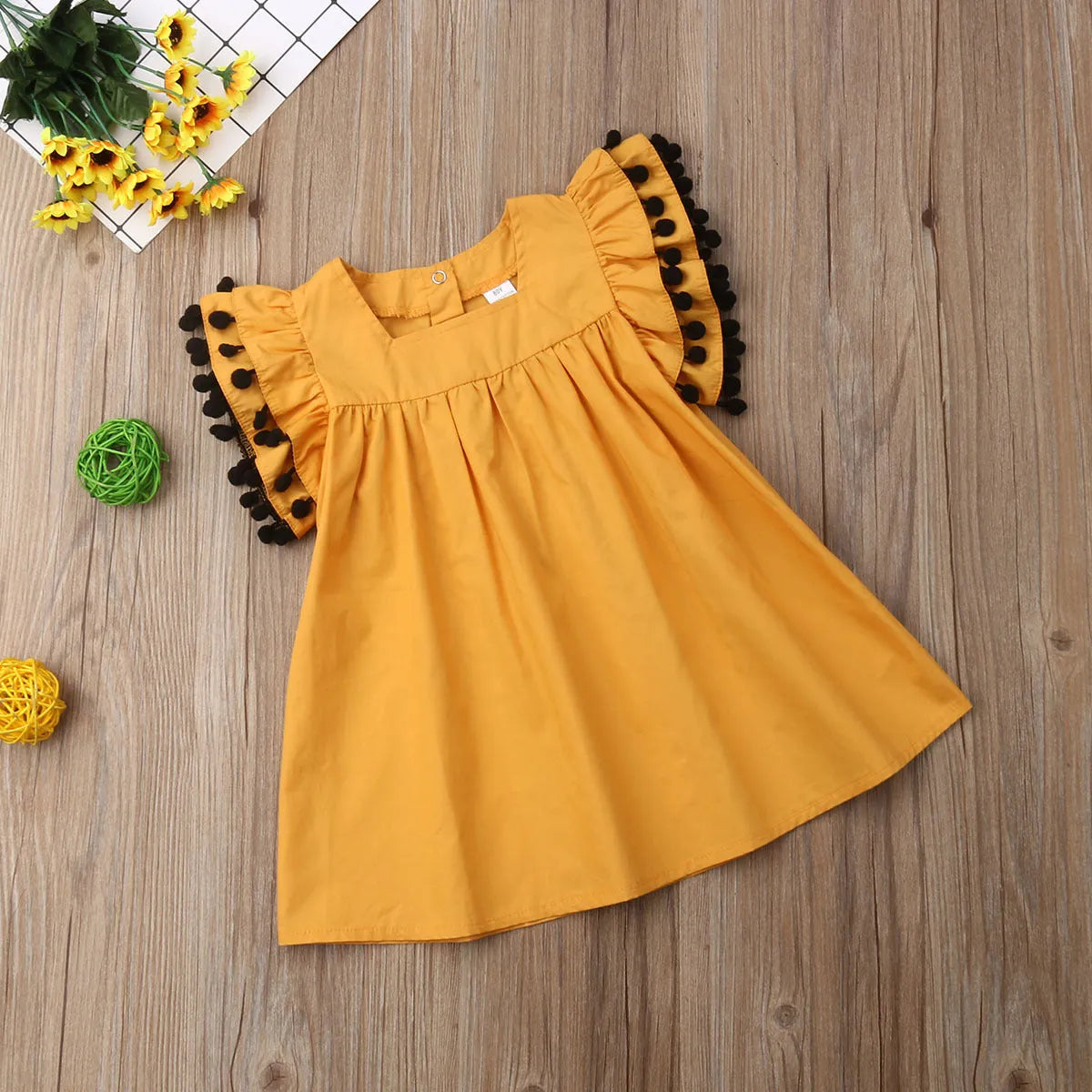Sleeveless orange cotton girls dress for toddlers and children sizes 12M to 5T