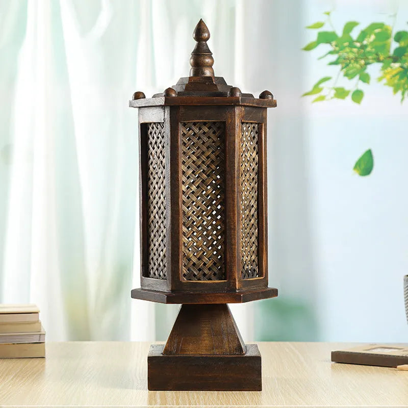 Retro wooden table lamp with hand-woven straw rattan lampshade on bedside table