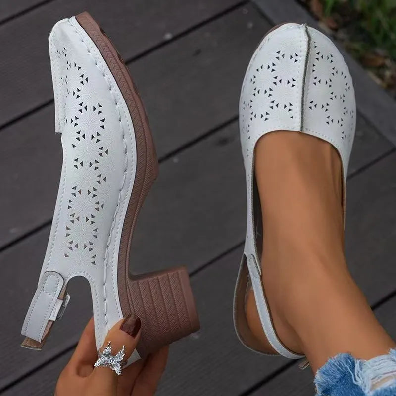 Women's black closed toe wedge sandals with a round toe and rubber sole on a white background.