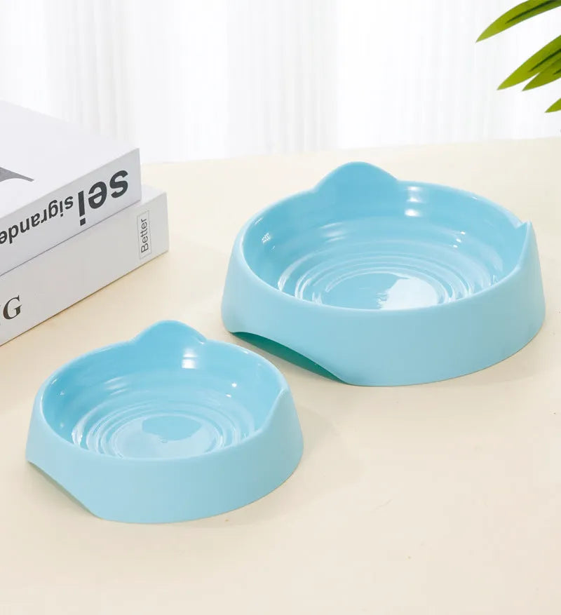 Ceramic dog slow feeder bowl with puzzle maze design in blue, green and pink colours showing S and L size options