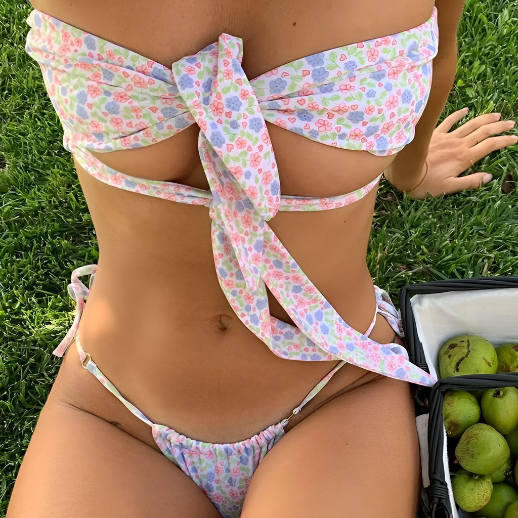 Women's floral print lace-up swimsuit with wireless cup and briefs style bottom.