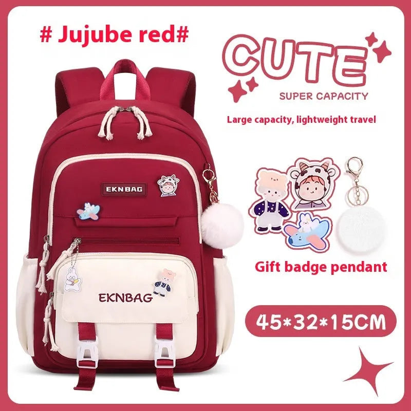 Girls' pink waterproof Oxford cloth school backpack with curved shoulder straps.