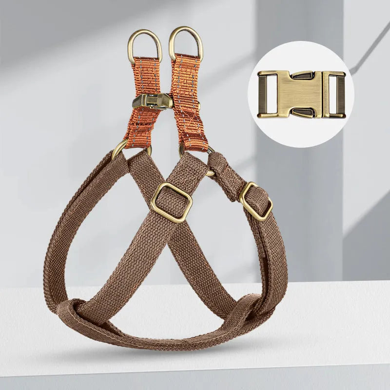 Brown vest-style dog leash with cotton belt and nylon construction on small dog