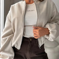 Women's off-shoulder short coat with lantern sleeves in polyester fabric