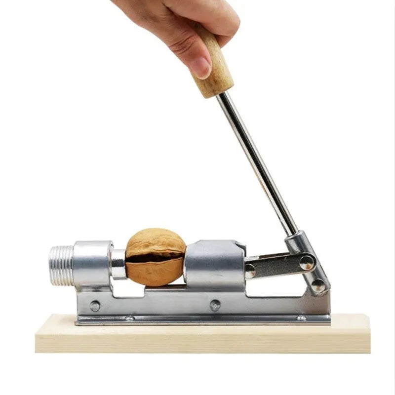 Mechanical walnut cracker tool with wooden board base and aluminium lever mechanism