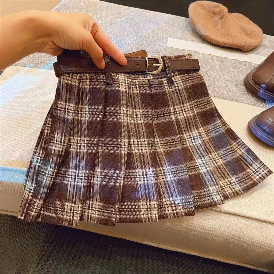 Girls' plaid pleated skirt in cotton blend fabric showing A-line silhouette