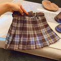 Girls' plaid pleated skirt in cotton blend fabric showing A-line silhouette