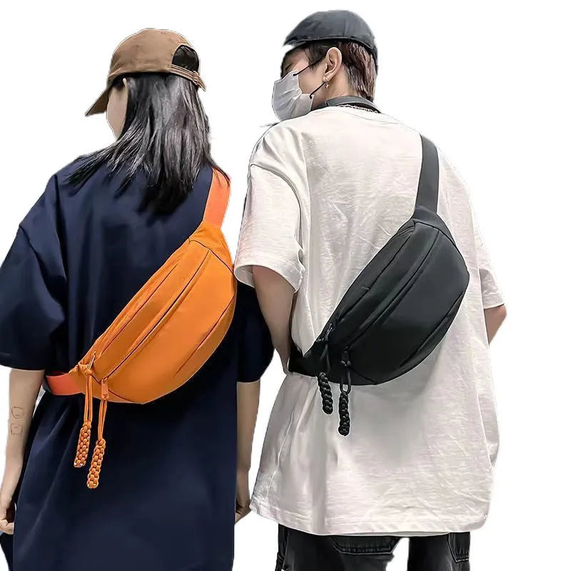 Small men's polyester crossbody chest bag in black with nylon lining and 35cm width
