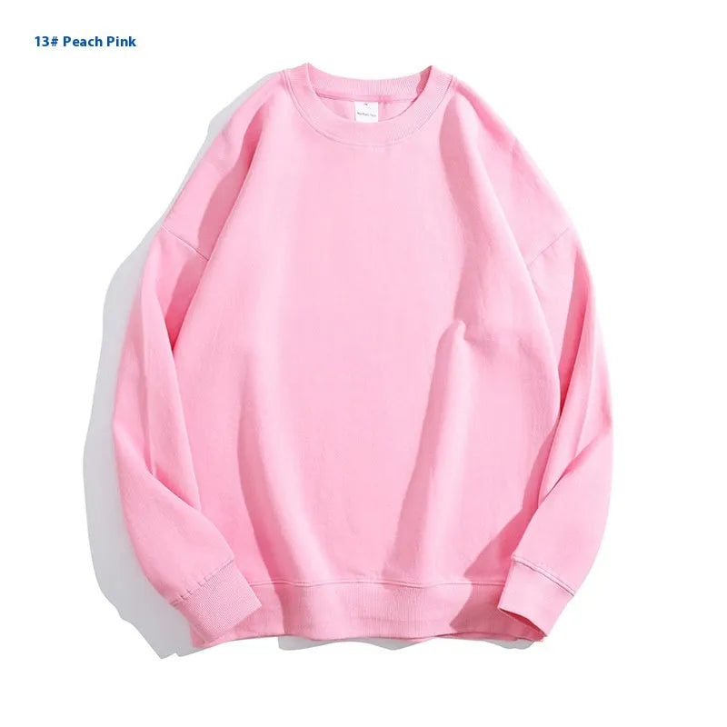 Cotton off shoulder pullover sweater in a loose fit, shown in a solid colour with long sleeves.