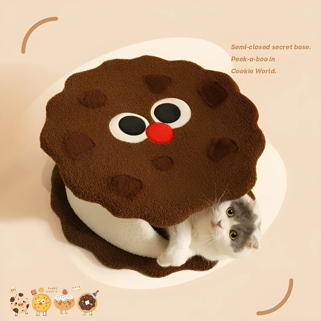 Khaki coloured enclosed cat nest shaped like a sandwich cookie for cold weather sleeping.