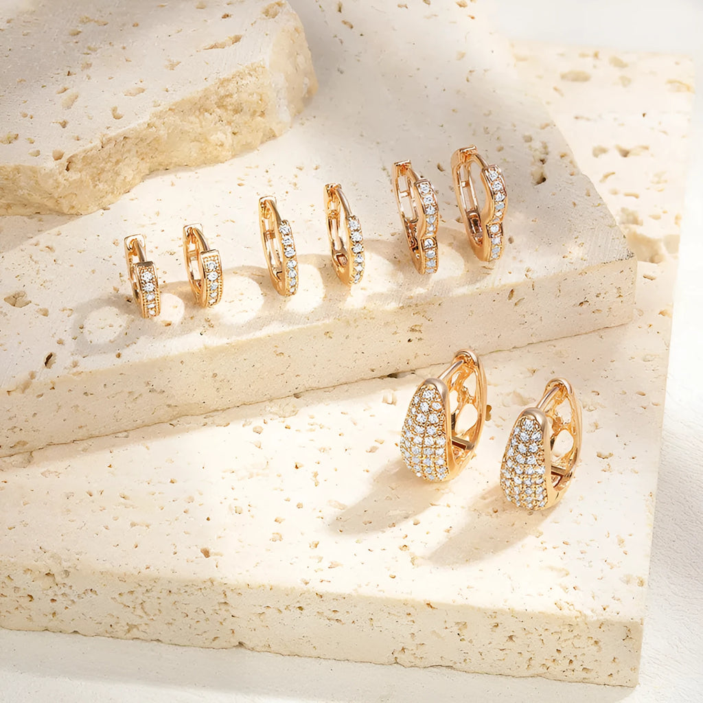 Brass gold plated heart-shaped ear clip earrings with gang drill decorative elements in electroplated colours