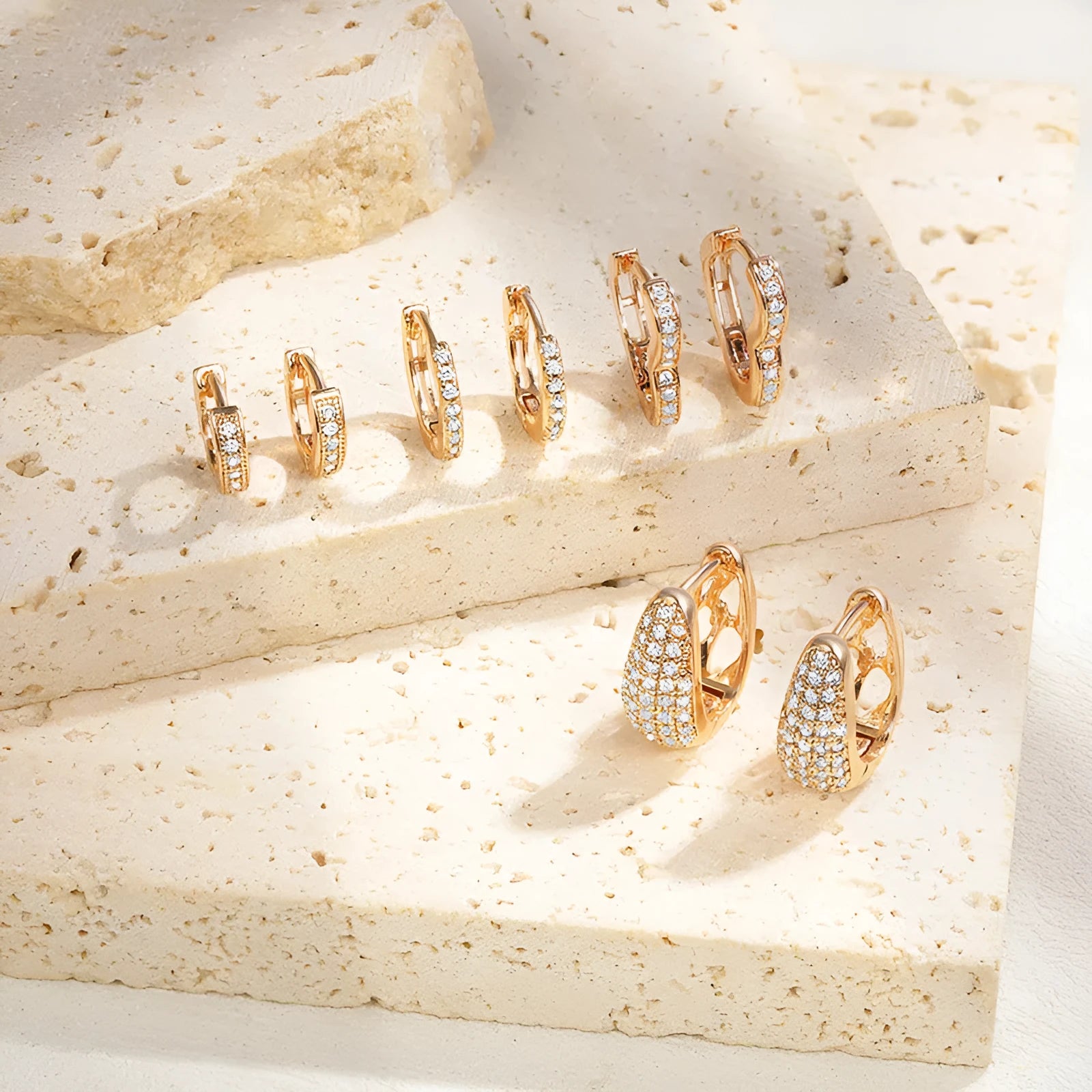 Brass gold plated heart-shaped ear clip earrings with gang drill decorative elements in electroplated colours