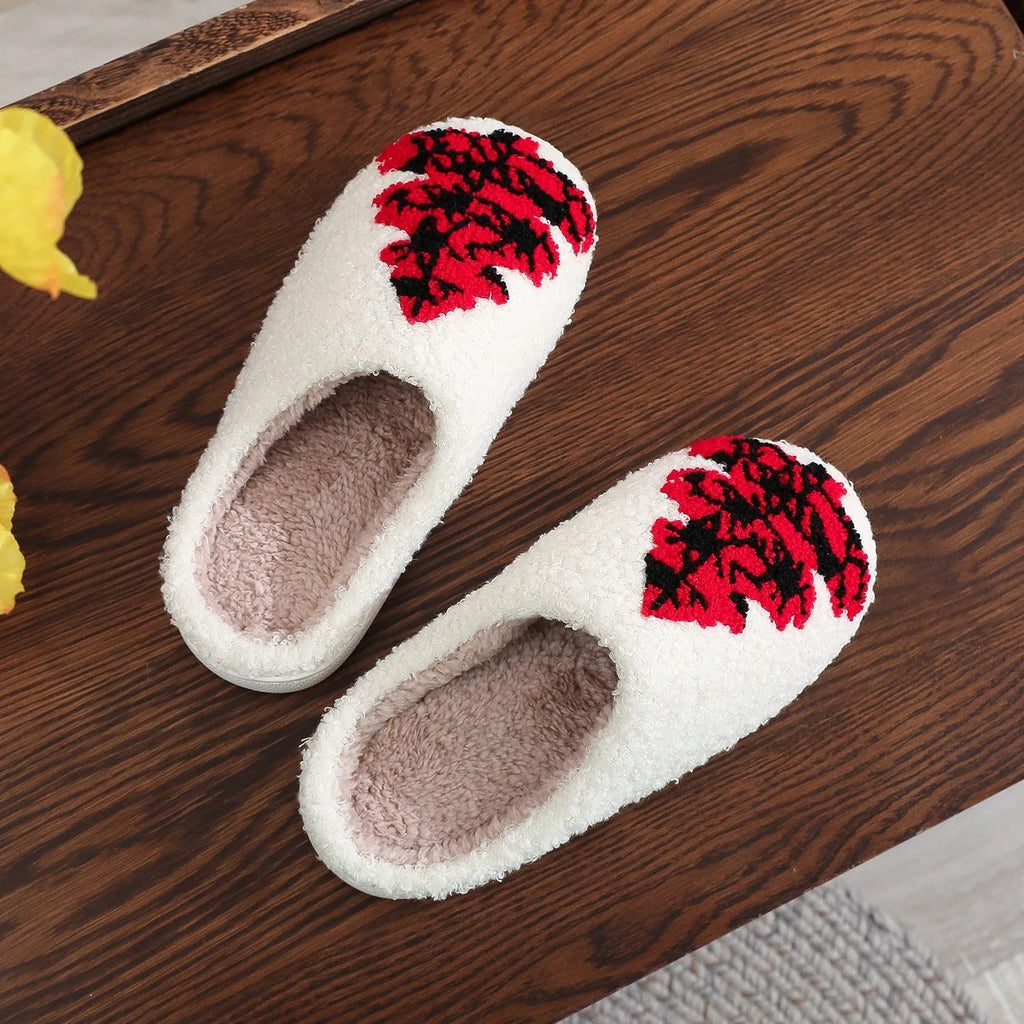 Pair of Christmas tree patterned slippers with plush upper and plastic non-slip sole
