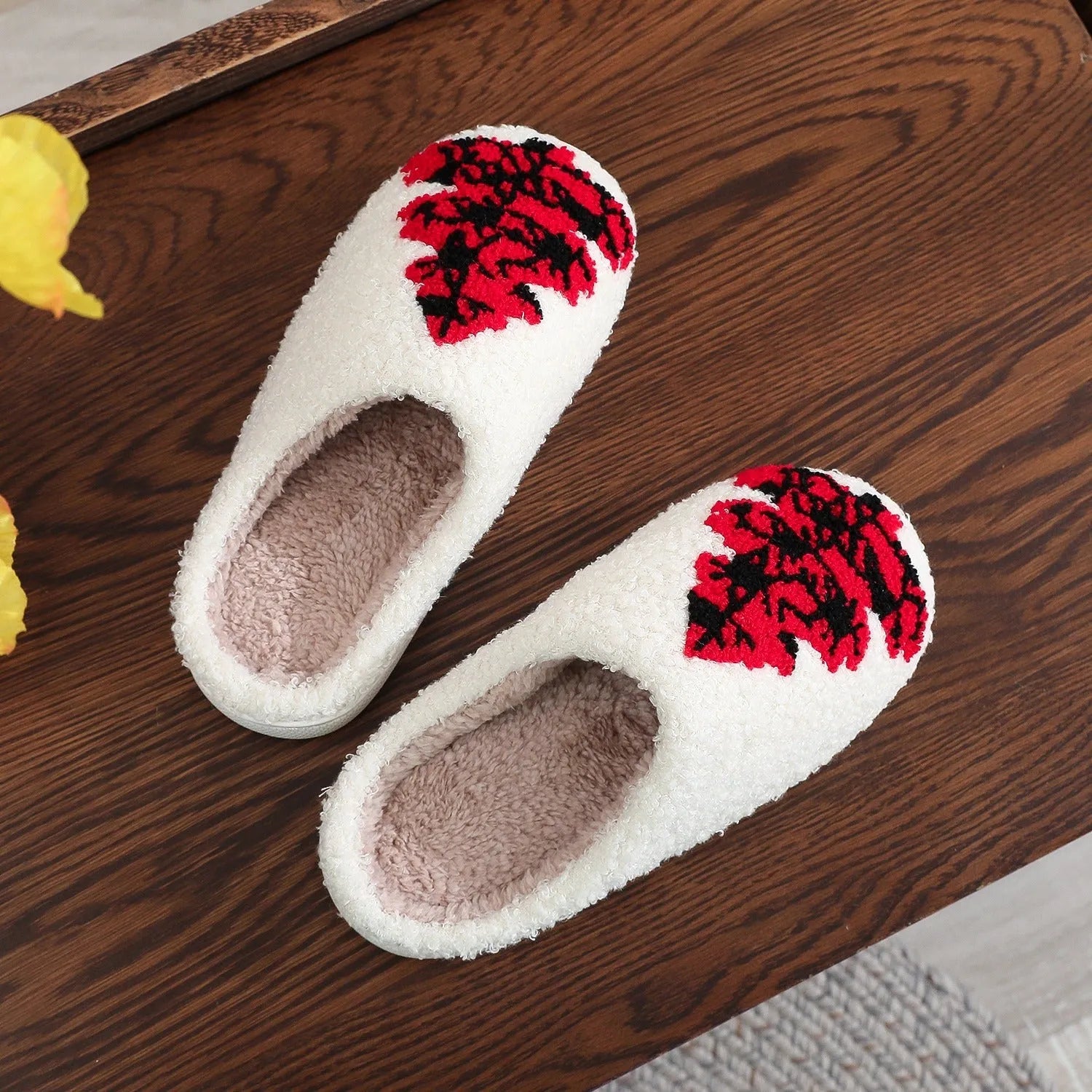 Pair of Christmas tree patterned slippers with plush upper and plastic non-slip sole