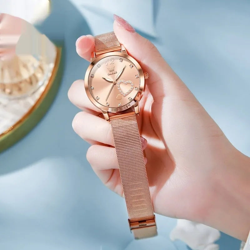 Women's fashion watch with rose shell alloy case and mesh strap, shown in multiple dial colour options.