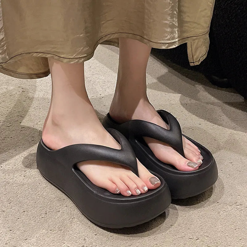 Women's thick-soled height increasing EVA flip-flops with herringbone strap in solid black