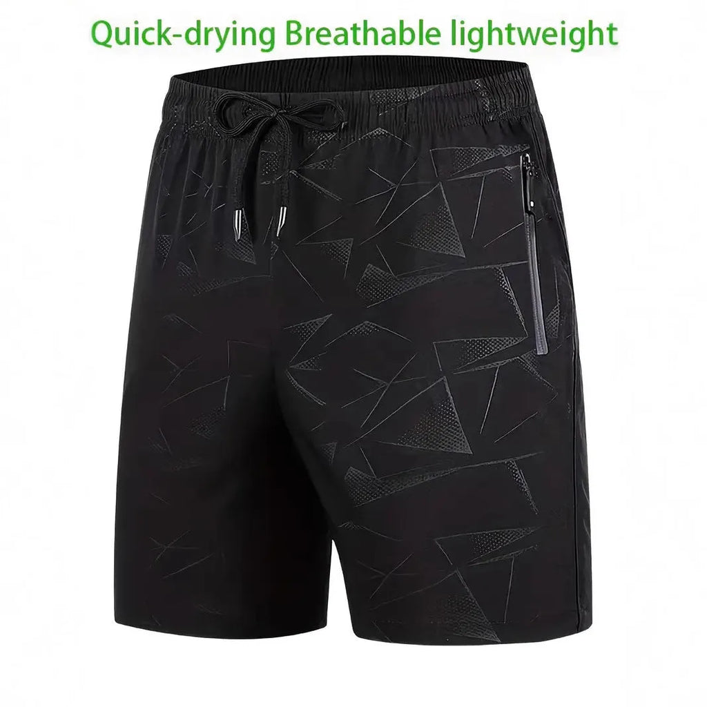 Man wearing loose fit black polyester sports shorts with elastic waistband