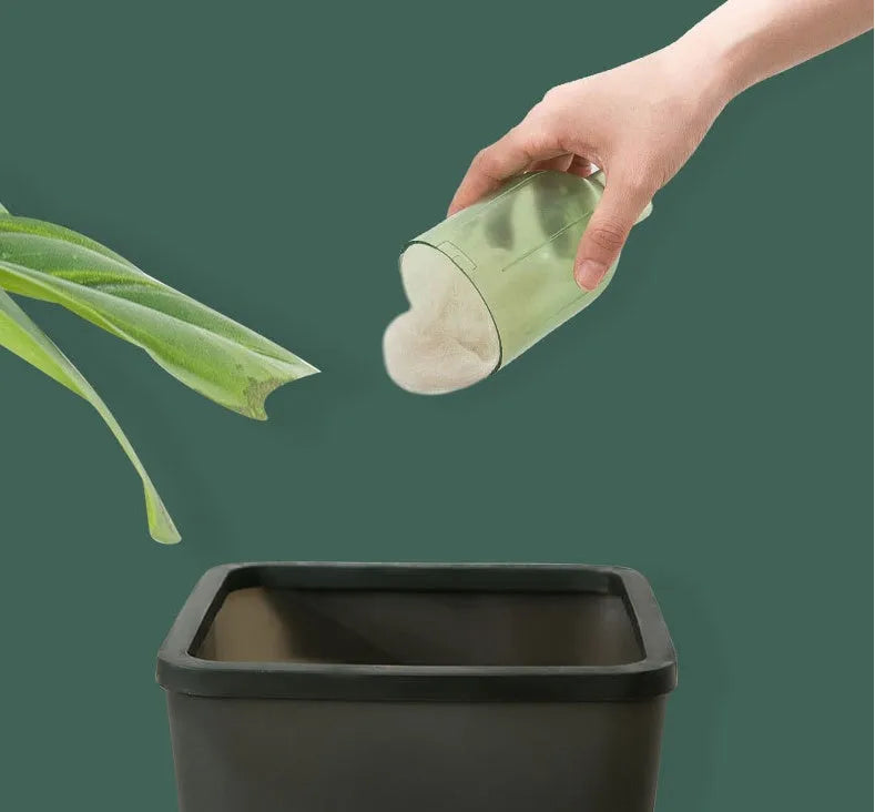 Green electric cat hair cleaner with suction heads for beds