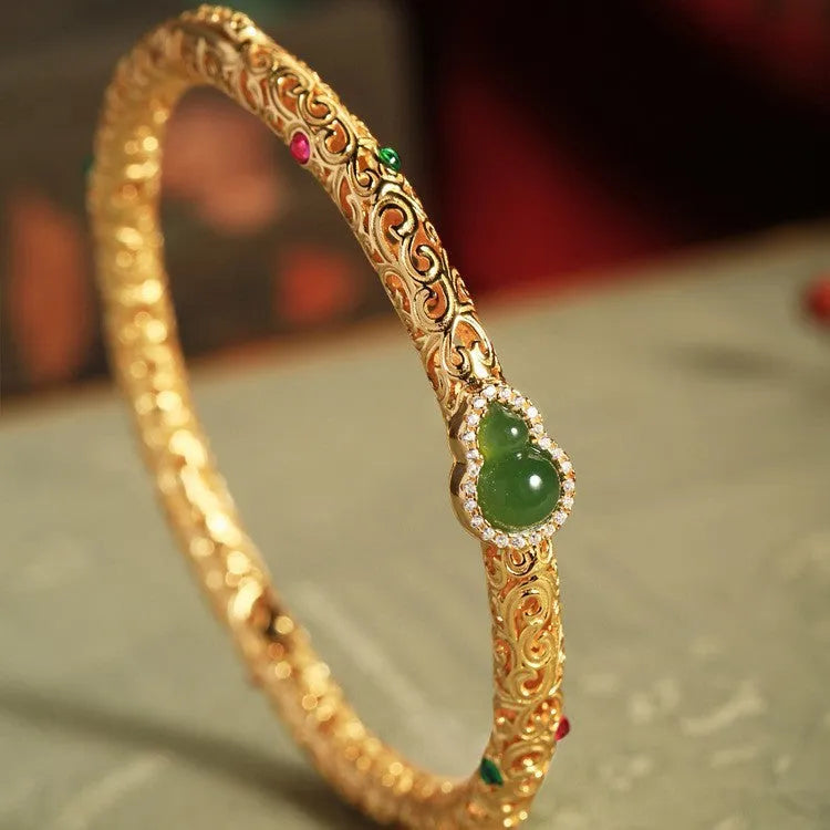Women's gold-plated silk bracelet with adjustable knot and traditional Chinese xiangyun gourd charm