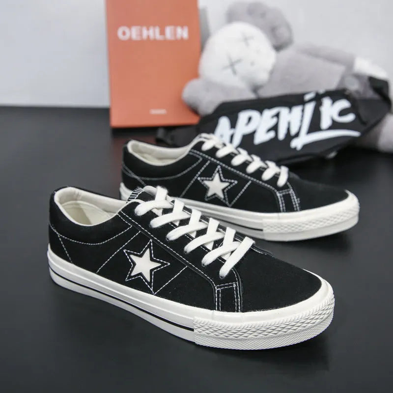 Low top board shoes with cross straps and leather stitching, available in green, black, light blue, grey, ink blue