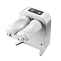 White automatic electric dumpling maker machine with charging cable, brush, and spoon.