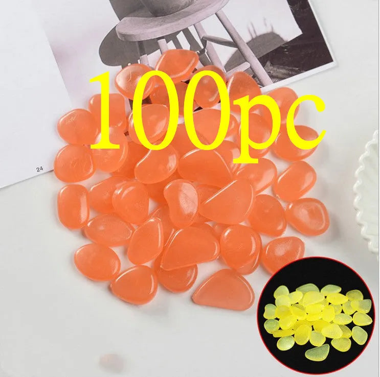 Luminous fluorescent aquarium and garden pebbles in mixed colours including dark purple, yellow, light blue, pink, orange