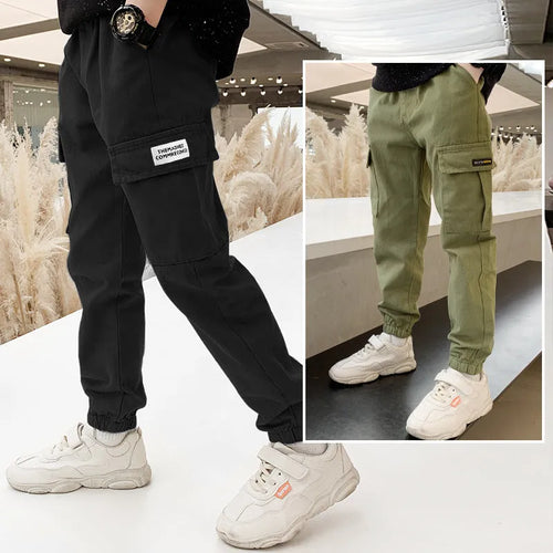 Boys' casual cotton summer trousers in army green, shown flat with size label visible.
