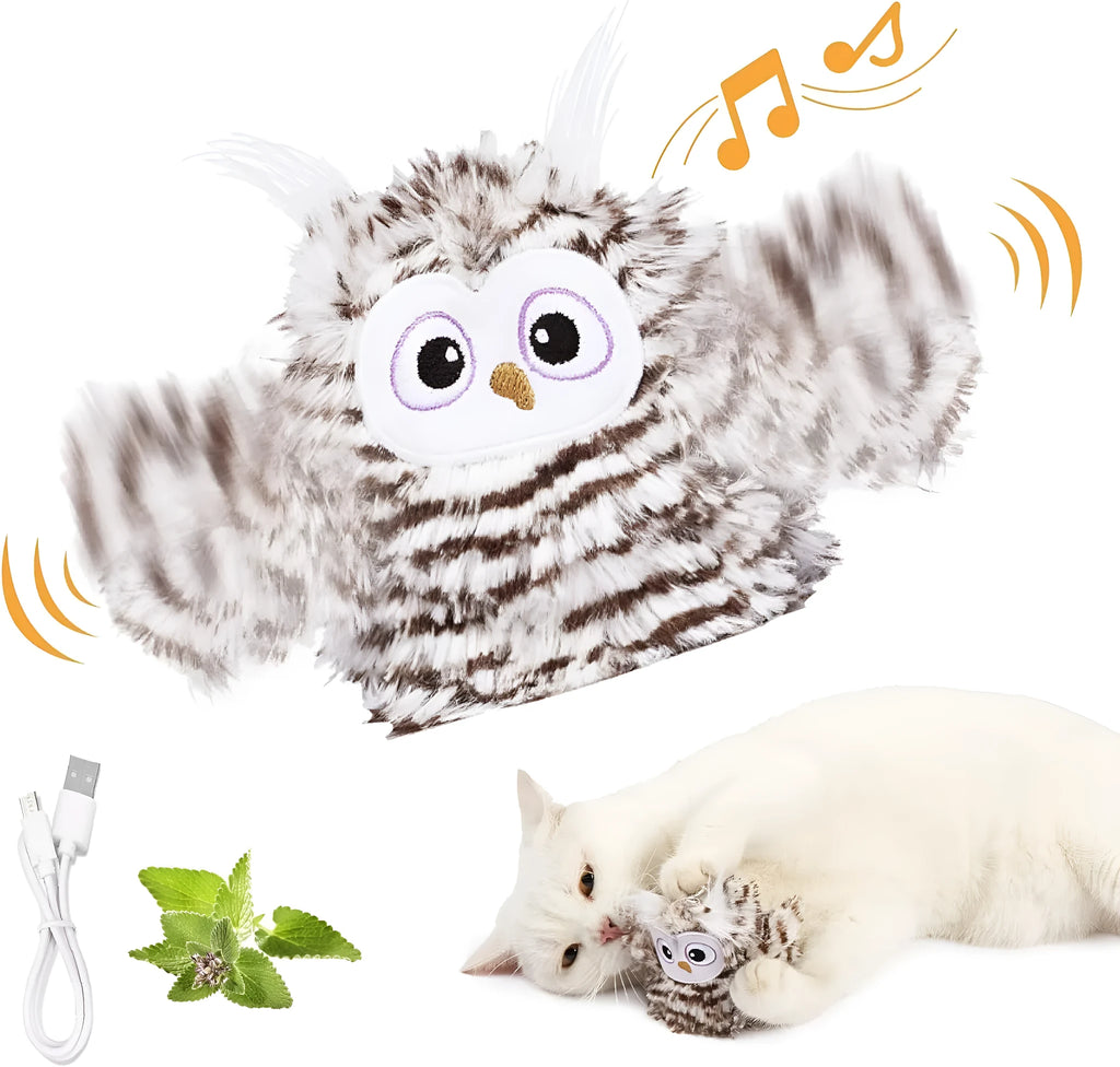 Grey automatic chirping owl cat toy with beating wings on a flat surface.