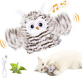 Grey automatic chirping owl cat toy with beating wings on a flat surface.