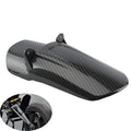 Carbon fibre rear shock absorber fender for a scrambling motorcycle.