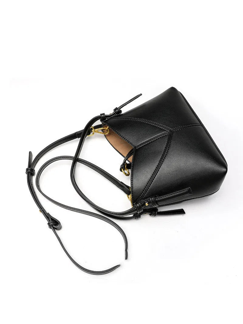 Women's oval PU handbag crossbody bag in black with stitched design and single shoulder strap