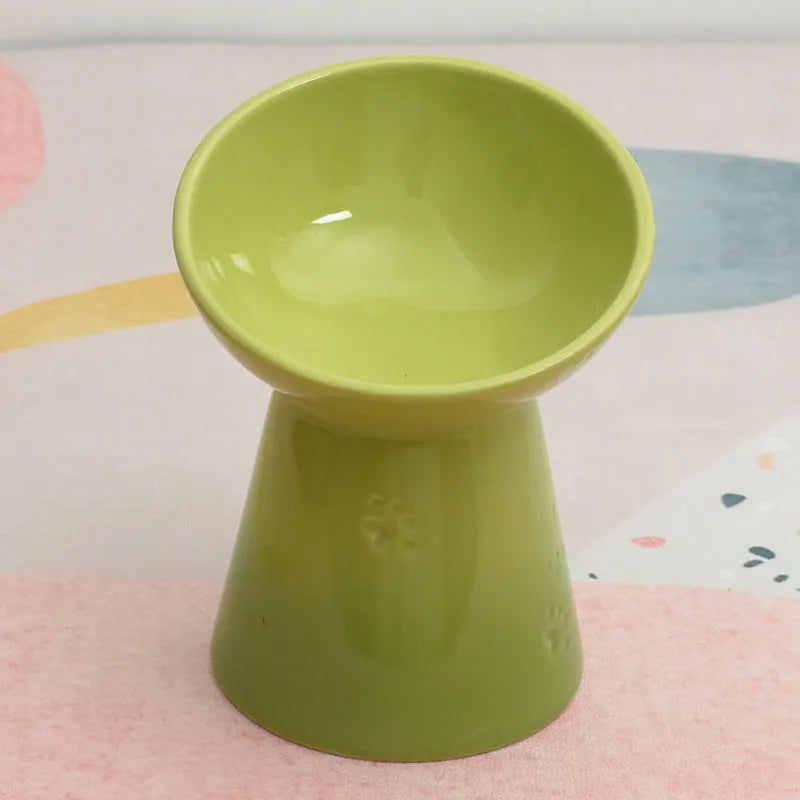 Black ceramic pet bowl with a high foot and neck protector to prevent tipping, shown with flat and slanted rim options.