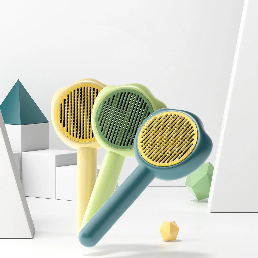 Blue pet grooming comb with stainless steel needles and a detachable cleaning cartridge on a white background.